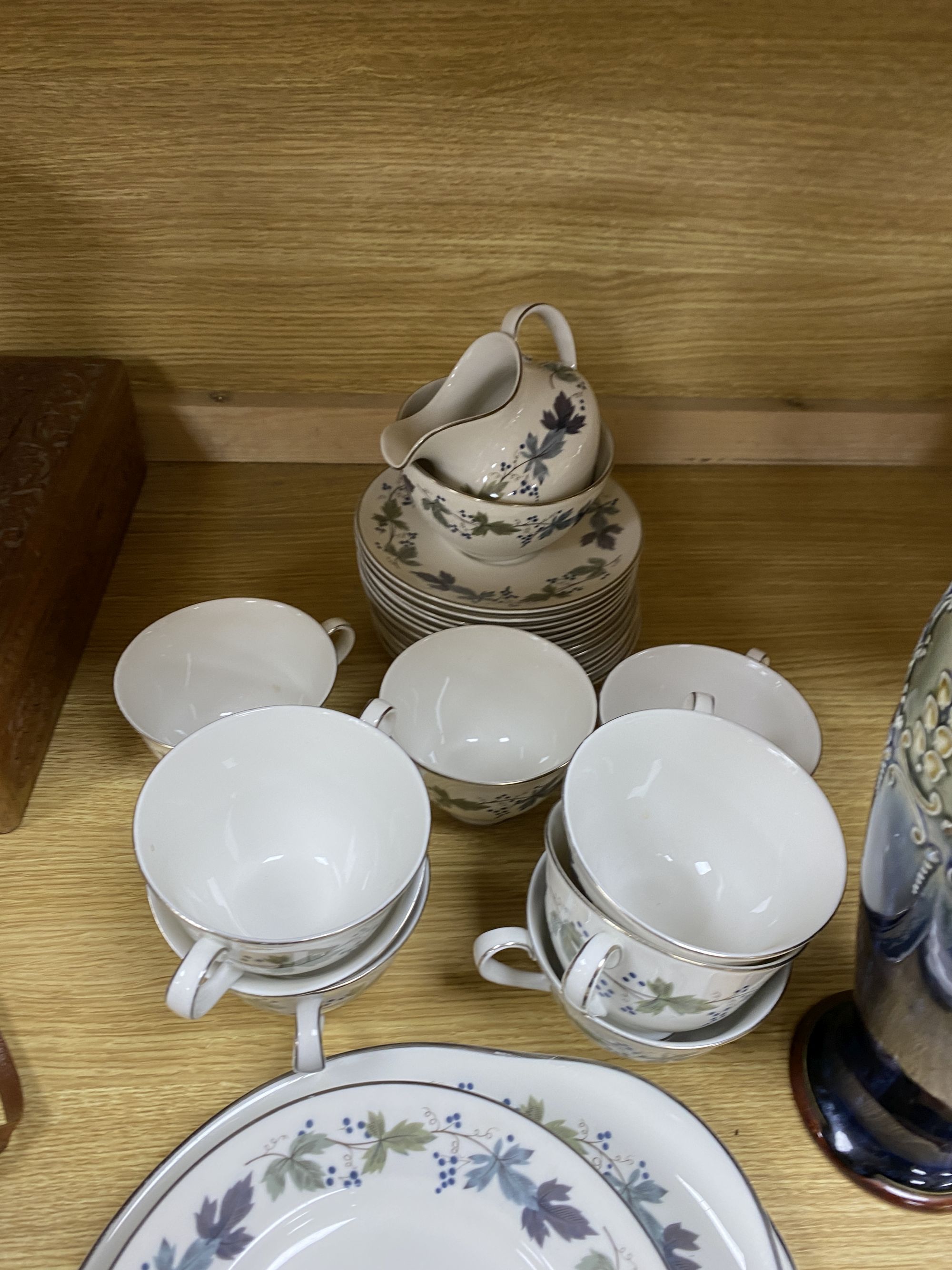 A Royal Doulton Burgundy pattern tea cups and saucers and a Doulton stoneware vase